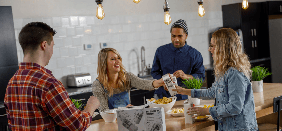 Alcove residents sharing a meal in a kitchen